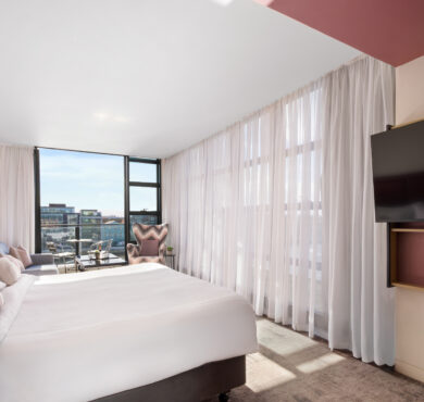 Stylish Junior Suite with king bed, separate seating area, and private balcony — perfect for a luxurious Dublin stay at The Spencer Hotel.