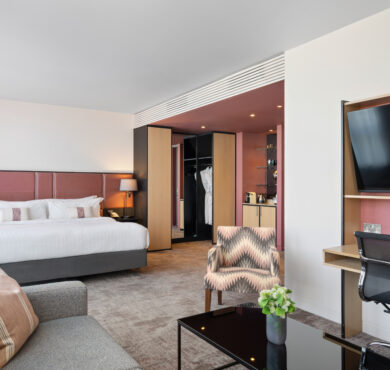 Stylish Junior Suite with king bed, separate seating area, and private balcony — perfect for a luxurious Dublin stay at The Spencer Hotel.